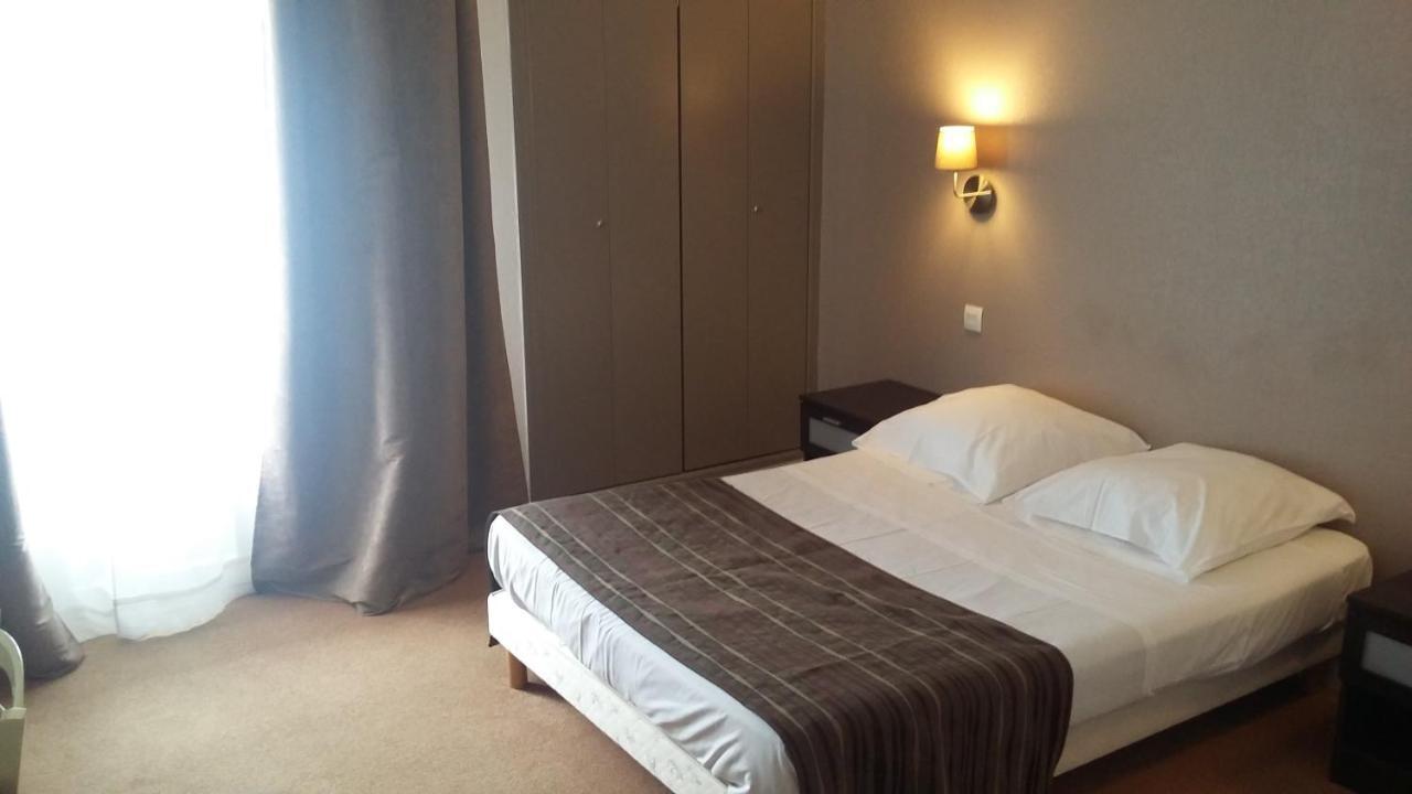 L' R Du Port Hotel Courseulles-sur-Mer Esterno foto